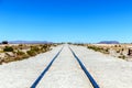 Endless rail road at Steam locomotives cemetery, Uyuni Salt flat, Bolivia