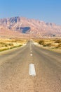 Endless road driving drive empty desert landscape portrait format loneliness infinite distance