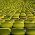 Endless rows of enpty chairs in a stadium