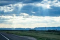 Endless rows of telephone wires as sunbeams shine down Royalty Free Stock Photo