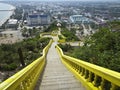 Endless staircase to the Buddhist temple in Prachuap Khiri Khan in Thailand. yellow staircase