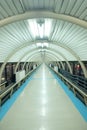 Endless tunnel walkway with metal sheet roof Royalty Free Stock Photo