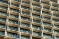 Endless web of apartment building balconies in matrix city urban areas with sliding glass doors in urban jungle Royalty Free Stock Photo