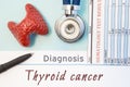 Endocrinology diagnosis Thyroid cancer. Figure of thyroid gland, result of laboratory analysis of blood, medical stethoscope and b Royalty Free Stock Photo