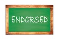 ENDORSED text written on green school board