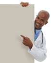 Endorsing your healthcare message. A young doctor pointing at an area reserved for copyspace.