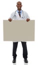 Endorsing your healthcare message. A young male doctor holding up a blank board. Royalty Free Stock Photo