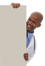 Endorsing your healthcare message. A young male doctor standing behind a board reserved for copyspace.