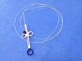 Endoscopic Instrument Polypectomy Snare In Blue Background. Selective Focus Royalty Free Stock Photo