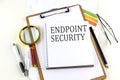 ENDPOINT SECURITY text on notebook with clipboard on white background Royalty Free Stock Photo