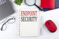 ENDPOINT SECURITY text on a notepad with laptop on the white background Royalty Free Stock Photo