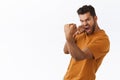 Endurance, motivated and power concept. Good-looking bearded man ready for fight, looking excited and determined Royalty Free Stock Photo