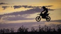 Enduro Bike jumping at sunset