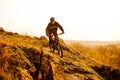 Enduro Cyclist Riding the Mountain Bike Down Beautiful Rocky Trail. Extreme Sport Concept. Space for Text. Royalty Free Stock Photo