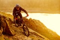 Enduro Cyclist Riding the Mountain Bike Down Beautiful Rocky Trail. Extreme Sport Concept. Space for Text. Royalty Free Stock Photo