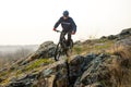 Enduro Cyclist Riding the Mountain Bike Down Beautiful Rocky Trail. Extreme Sport Concept. Space for Text. Royalty Free Stock Photo