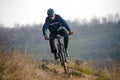 Enduro Cyclist Riding the Mountain Bike Down Beautiful Rocky Trail. Extreme Sport Concept. Space for Text. Royalty Free Stock Photo