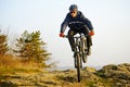 Enduro Cyclist Riding the Mountain Bike Down Beautiful Rocky Trail. Extreme Sport Concept. Space for Text. Royalty Free Stock Photo