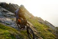 Enduro Cyclist Riding the Mountain Bike Down Beautiful Rocky Trail. Extreme Sport Concept. Space for Text. Royalty Free Stock Photo