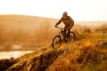 Enduro Cyclist Riding the Mountain Bike Down Beautiful Rocky Trail. Extreme Sport Concept. Space for Text. Royalty Free Stock Photo