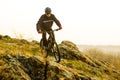 Enduro Cyclist Riding the Mountain Bike Down Beautiful Rocky Trail. Extreme Sport Concept. Space for Text. Royalty Free Stock Photo