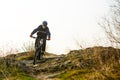 Enduro Cyclist Riding the Mountain Bike Down Beautiful Rocky Trail. Extreme Sport Concept. Space for Text. Royalty Free Stock Photo