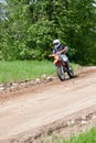 Enduro motorbike riding down the hill, Madona, Latvia, May 26, 2