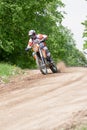 Enduro motorbike riding down the hill, Madona, Latvia, May 26, 2