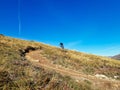 Enduro ride with steep bend, banked curve, Swiss Mountain Alps at Davos Switzerland. With blue clear sky and great view