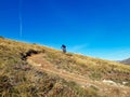 Enduro ride with steep bend, banked curve, Swiss Mountain Alps at Davos Switzerland. With blue clear sky and great view