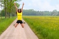 Energetic agile young woman leaping for joy