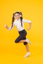 Energetic back to school songs that will get you moving. Energetic child is hurrying to school on yellow background