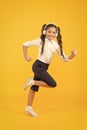 Energetic back to school songs that will get you moving. Energetic child is hurrying to school on yellow background