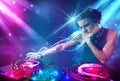 Energetic Dj mixing music with powerful light effects