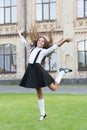 Energetic kid with long wavy hair wear uniform outdoors. Back to school look. Hair salon. Hairdressing school. Education