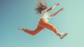 Energetic Leap Against Blue Sky Royalty Free Stock Photo