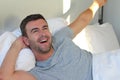 Energetic man waking up in the morning Royalty Free Stock Photo