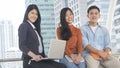 Energetic optimistic teen people and business woman sit and smile on bench outdoor public