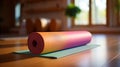 Energetic woman rolling up vibrant yoga mat at home for rejuvenating and revitalizing practice