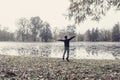 Energetic young boy jumping for joy with outstretched arms Royalty Free Stock Photo