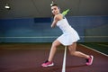 Energetic Young Woman Playing Tennis Royalty Free Stock Photo