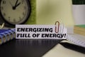 Energizing Full of Energy! on the paper isolated on it desk. Business and inspiration concept