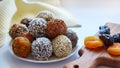 Energy balls close-up. Raw, vegan, wholesome food with nuts, chia seeds, sesame seeds, flax, coconut flakes and dried fruits, Royalty Free Stock Photo