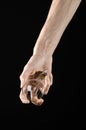 Energy consumption and energy saving topic: human hand holding a light bulb on black background in studio