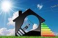 Energy Efficiency - Model House with Light Bulb Royalty Free Stock Photo