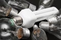 Energy efficient bulb in the middle of old incandescent Royalty Free Stock Photo