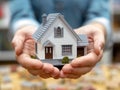 Energy-Efficient Home Concept. Mini house model in hands Royalty Free Stock Photo