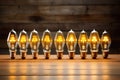 energy-efficient light bulbs arranged on a wooden table Royalty Free Stock Photo