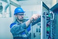 Energy and electricity, electromechanical protective at work with an electric panel, an electrician diagnoses electrical