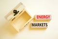 Energy markets symbol. Concept words Energy markets on wooden block. Beautiful white table white background. Empthy opened wooden